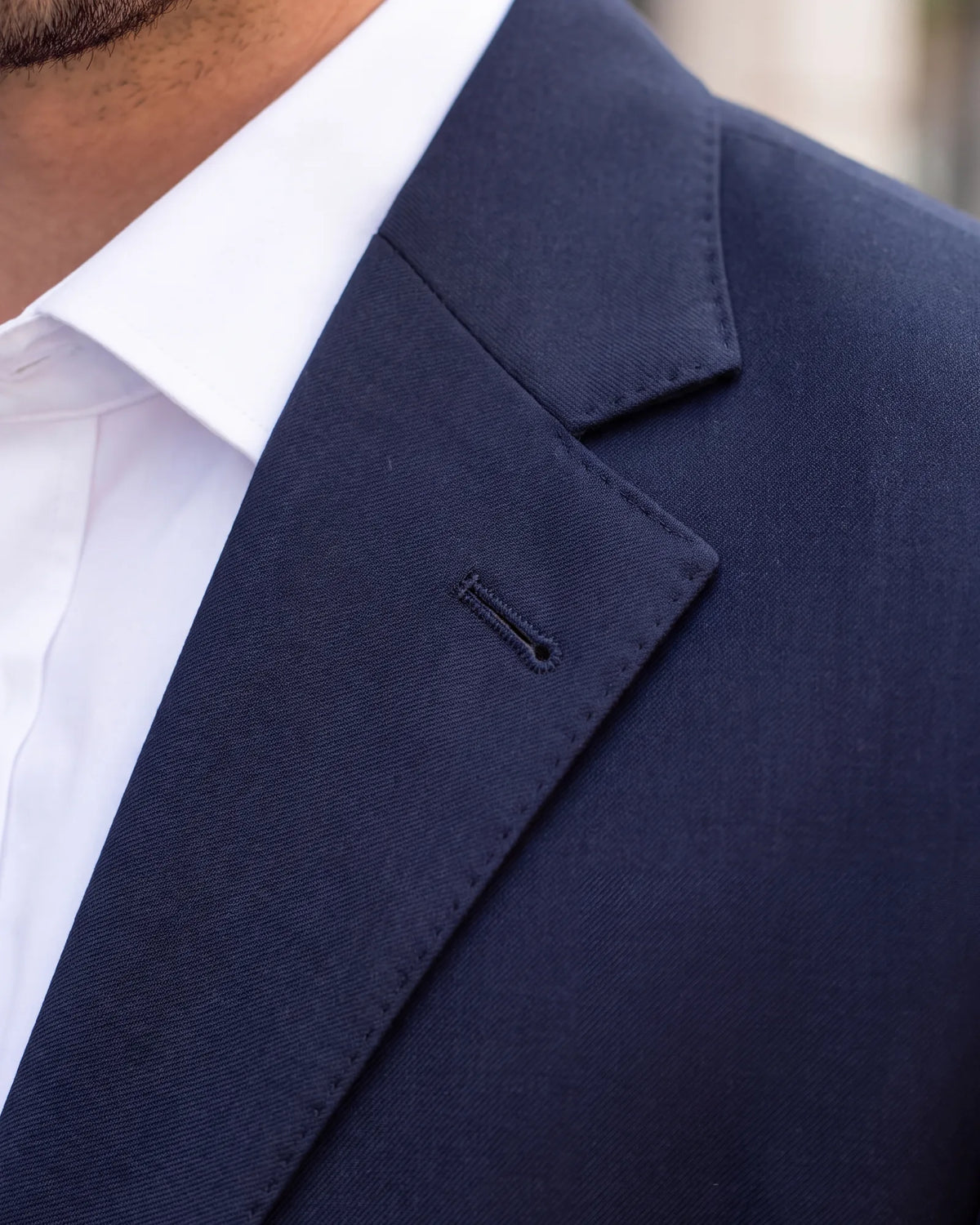 Planning to wear a boutonniere or a lapel pin? It goes in the buttonhole on the left lapel.