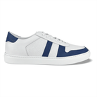 A blue and white men's sneaker with a lace-up closure, made of leather with a full-grain texture, featuring a perforated pattern on the side488