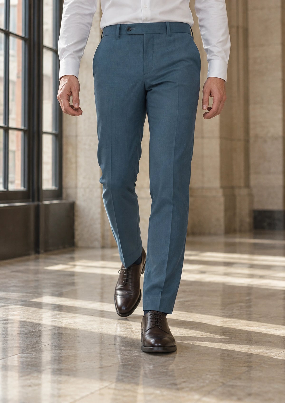 Olympic Blue Performance Pants worn by a model, office lobby 1930s726