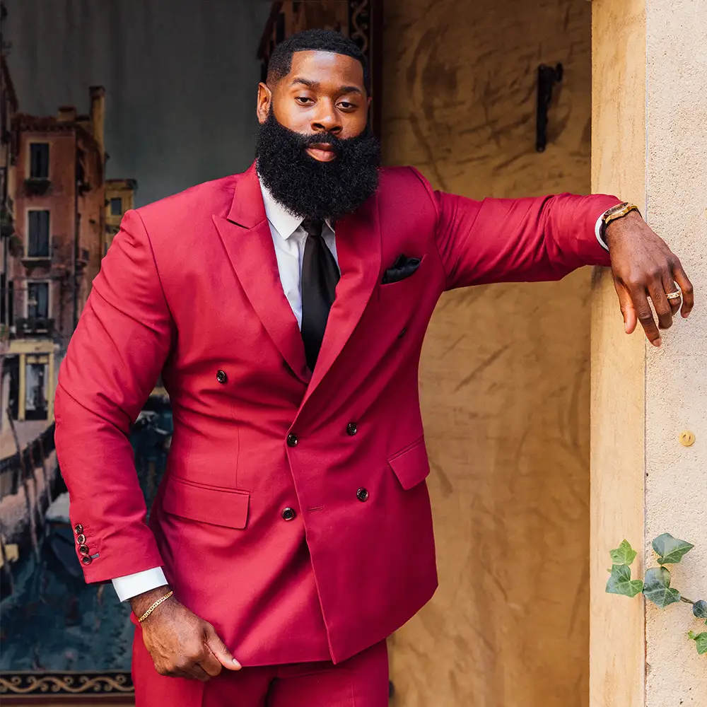 Queyon walking in our Claret Red Stretch Suit