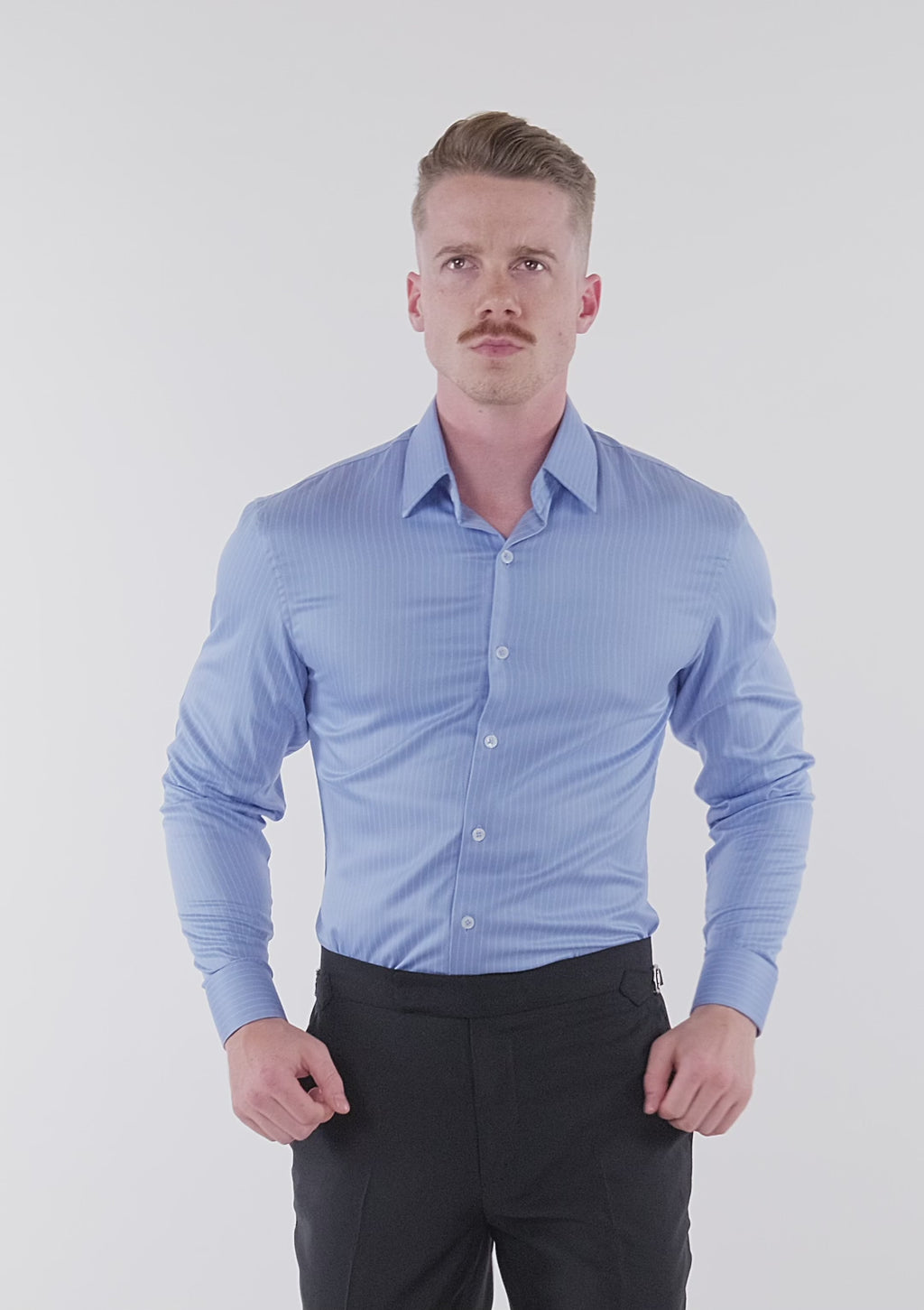 Man in light blue striped shirt