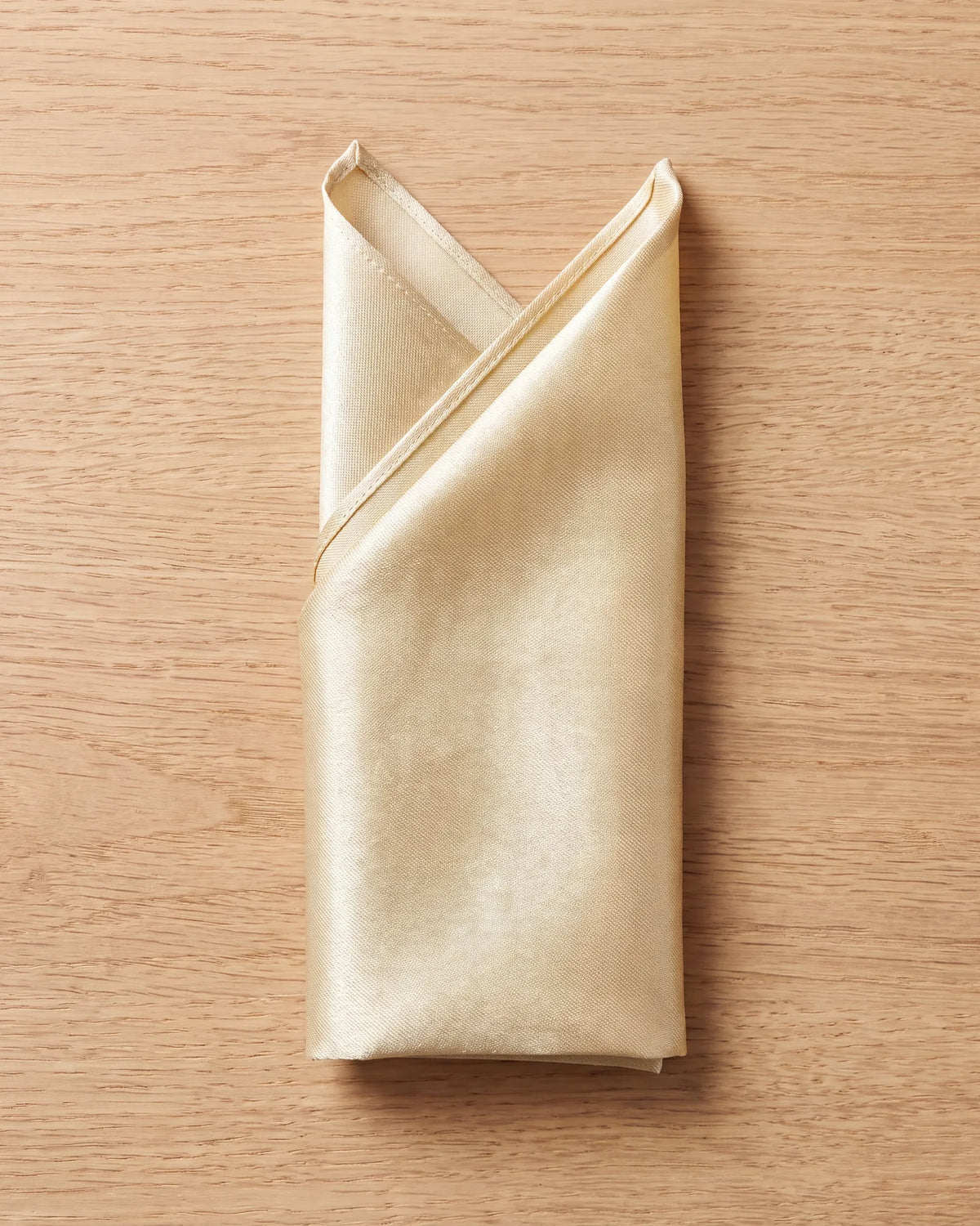 With both peaks set, fold the left side in and the right side over it to reach pocket width. The base fold comes last.