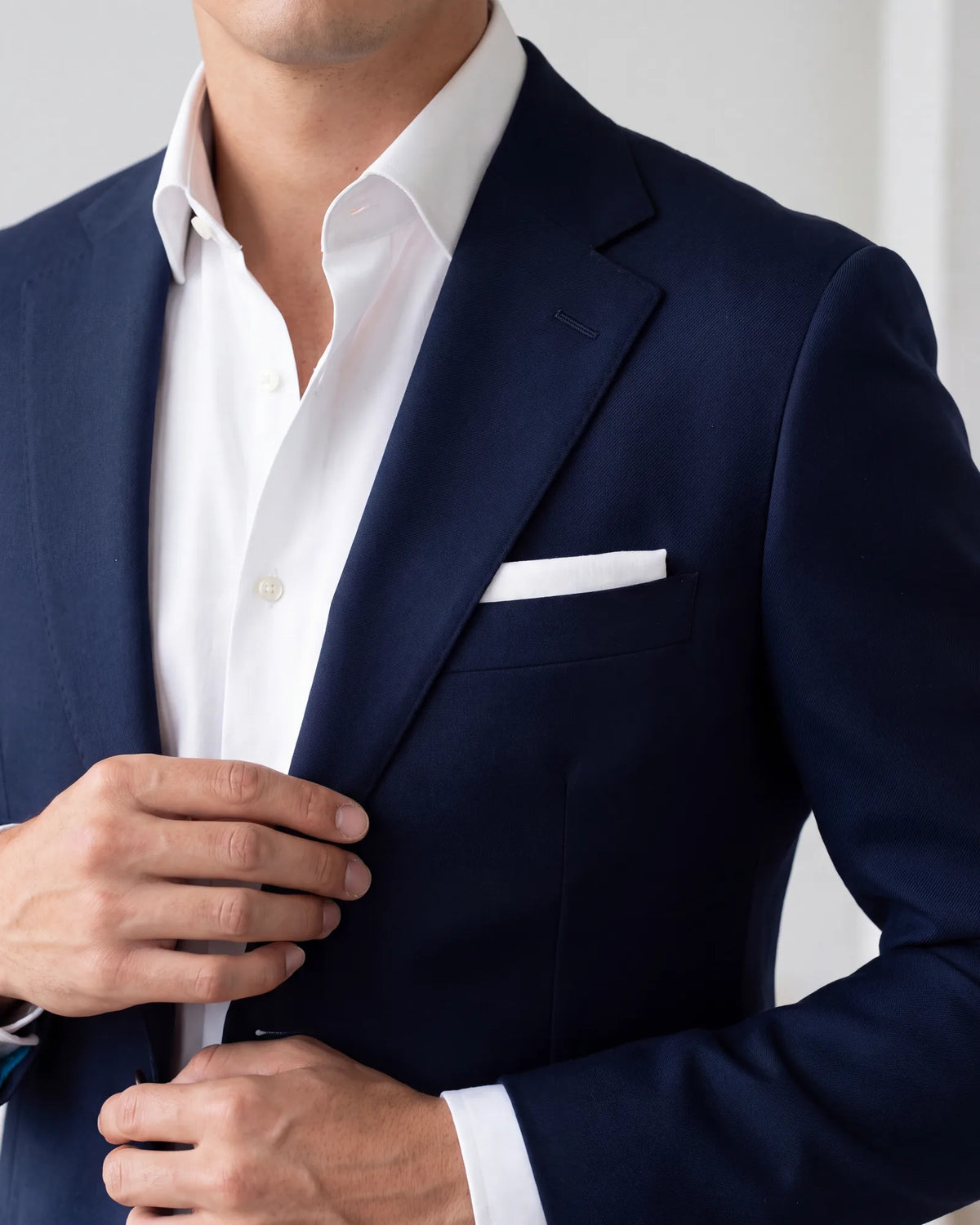 Only one pocket takes a pocket square: the breast pocket on the left. Never use it to wipe anything; that is a handkerchief's job.