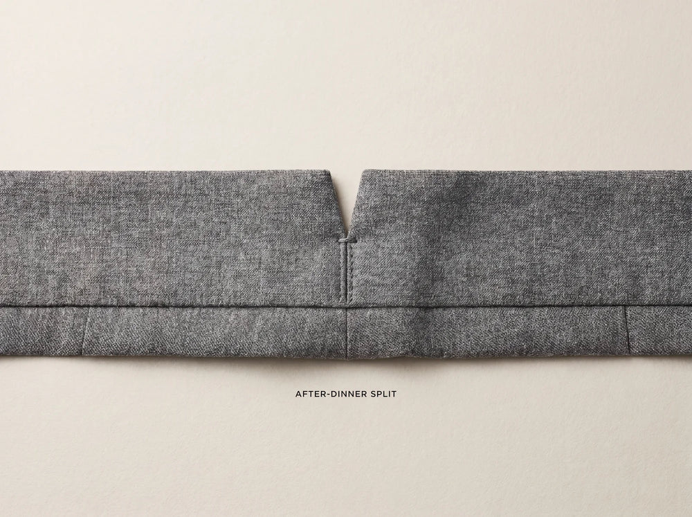 After-dinner split, the small V notch at the center-back waistband of grey wool suit trousers