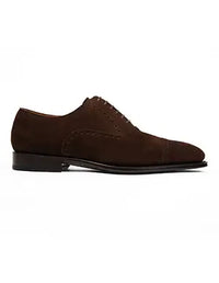 Brown suede dress shoe on a white background