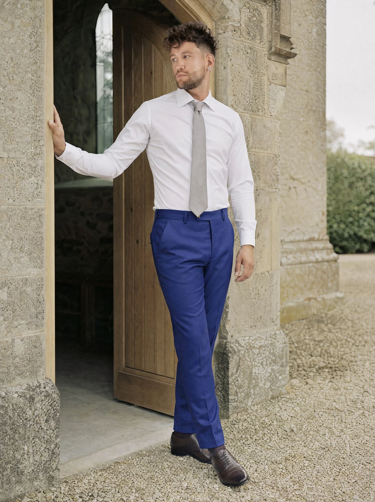 Royal Blue Twill Pants worn by a model, chapel doorway130