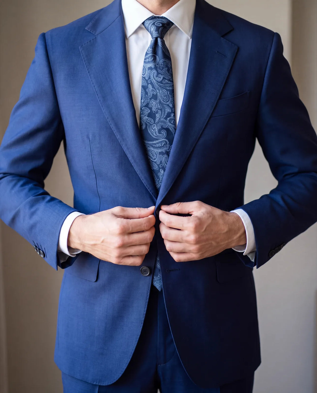Use the chart to get close, then button the jacket on. The fit, not the number, decides your size.
