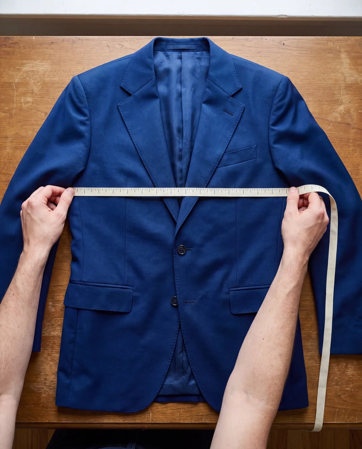 No tag on a jacket that fits? Measure it flat from armpit to armpit and double the number.