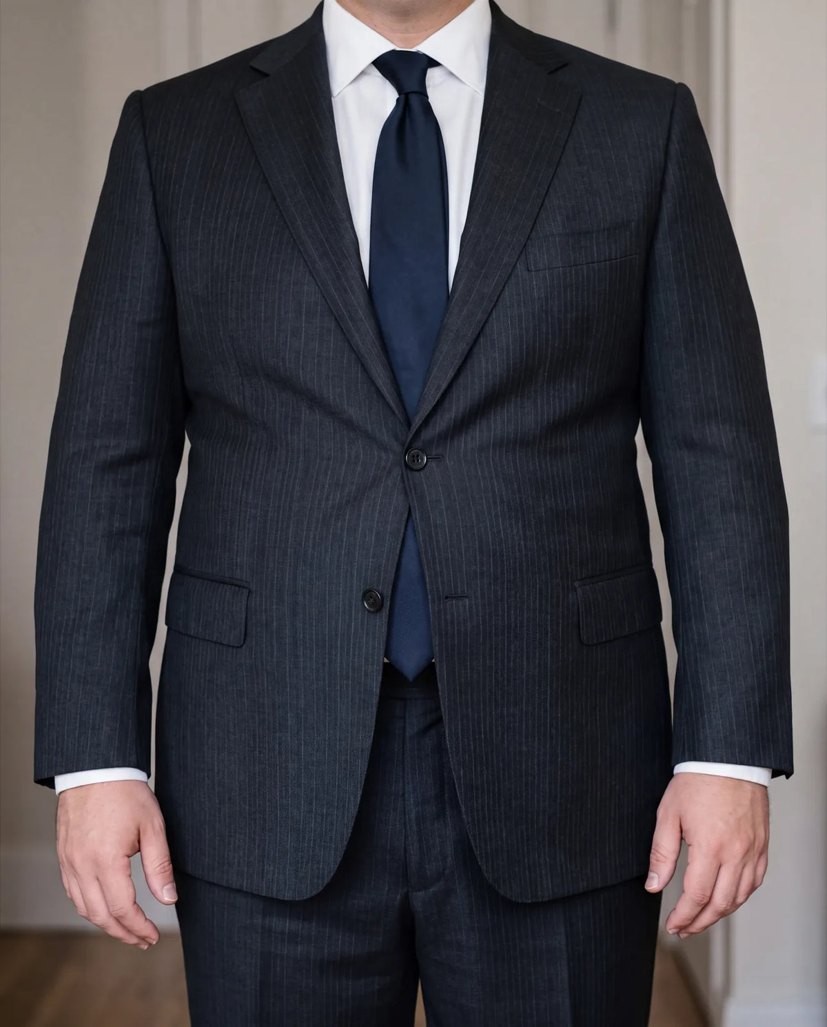Pulling at the button? The size matches your chest but not your stomach, which a chart can't measure.