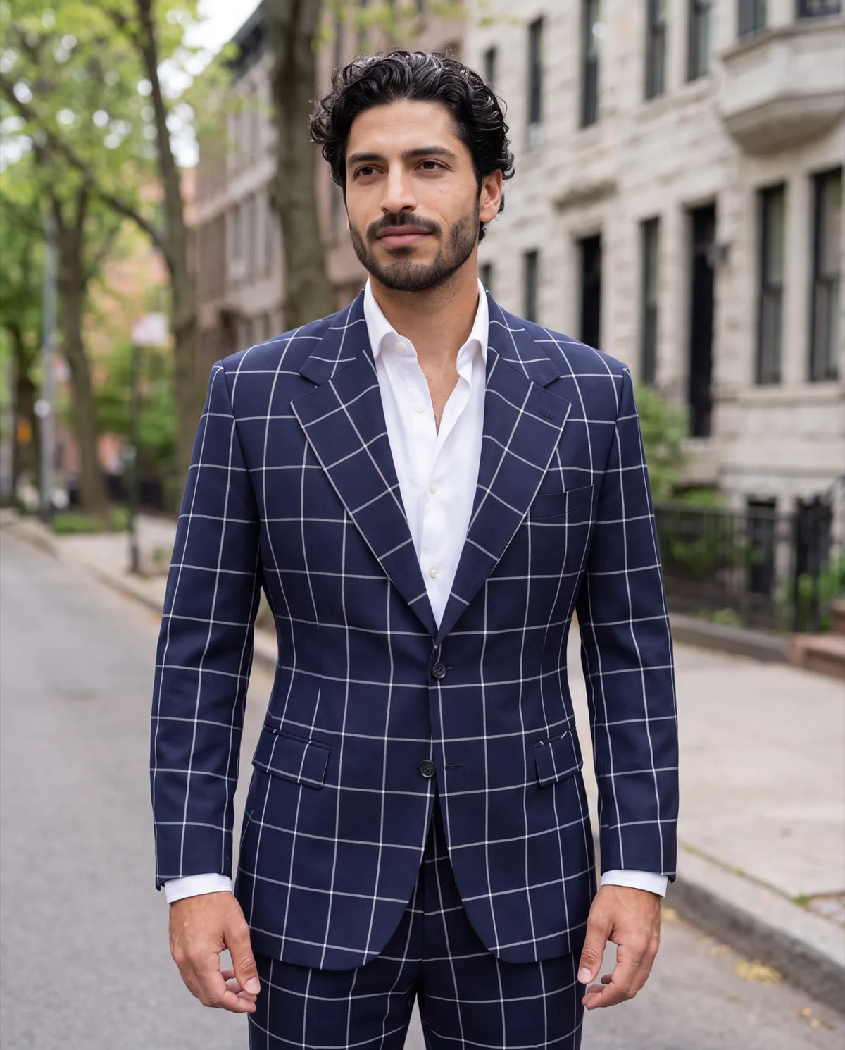 Custom means no size label to pick. The suit is cut from your Fit Profile instead.