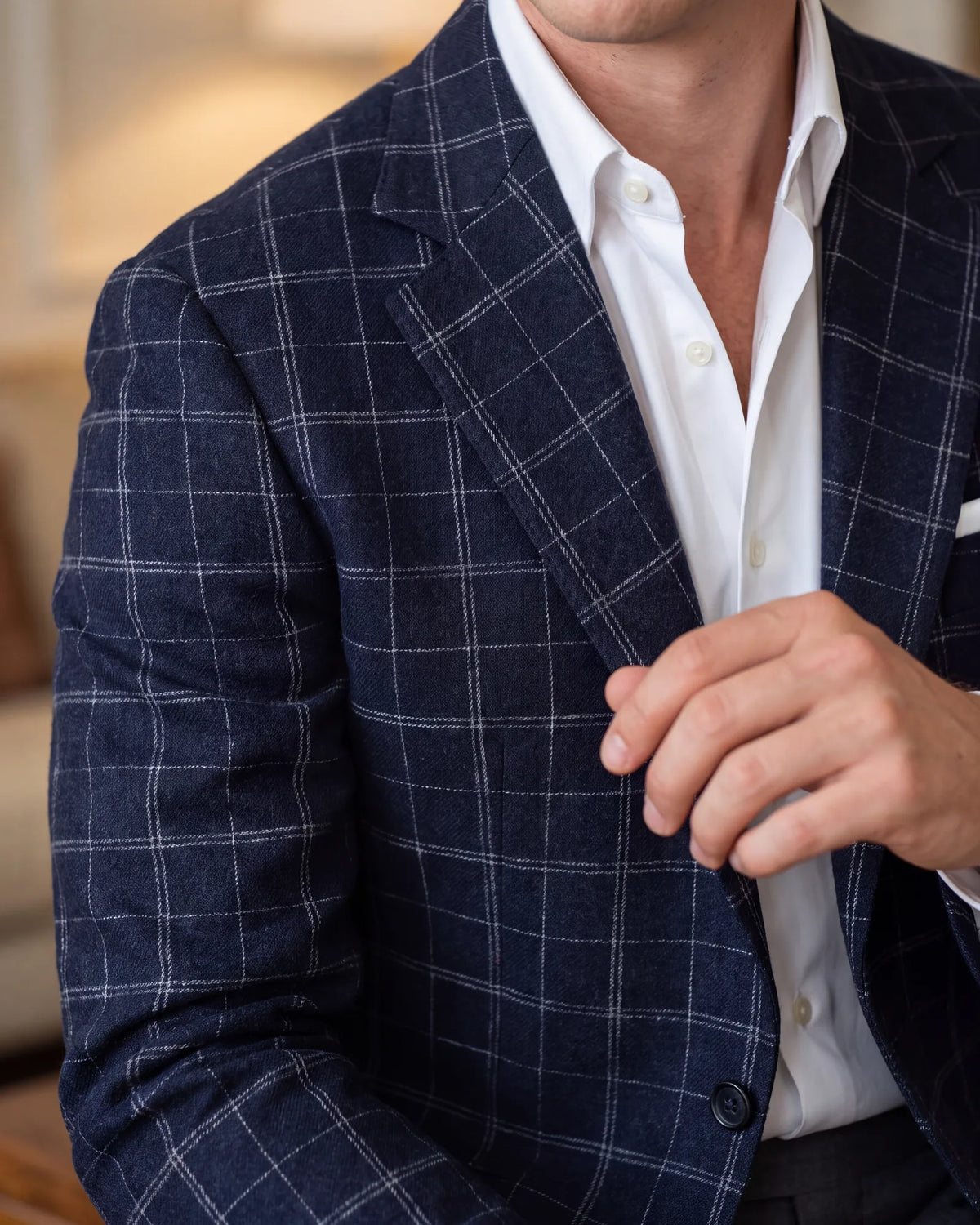 Choose an unstructured jacket in flannel, linen, herringbone or a quiet check. The texture is what sets it apart from a suit jacket.