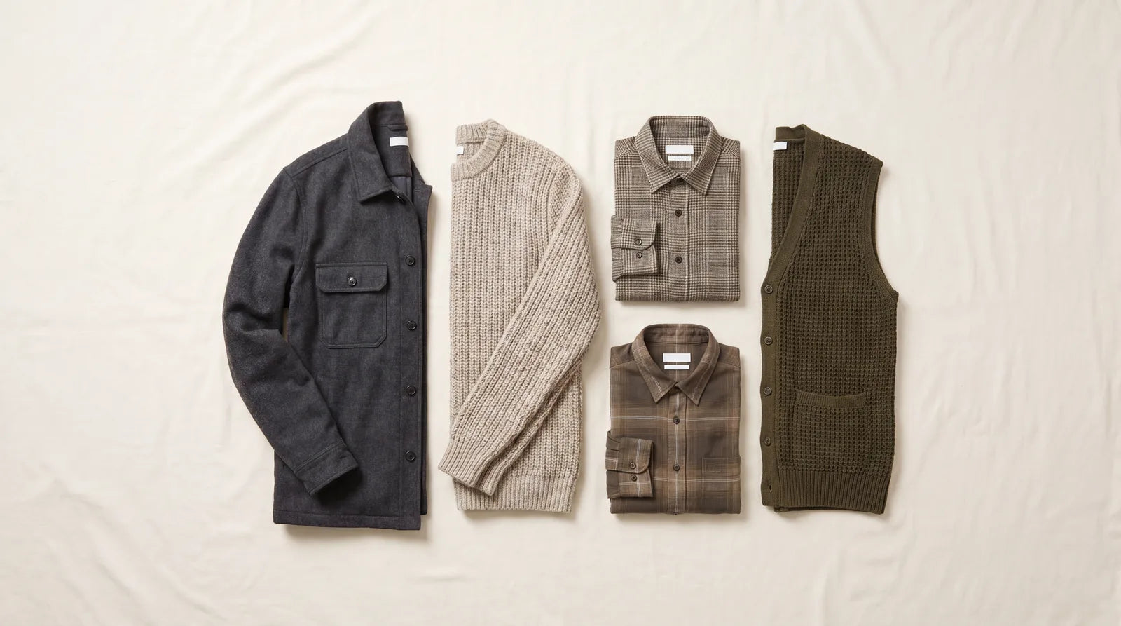 Textured menswear: a flannel overshirt, a chunky knit, patterned shirts, and a vest