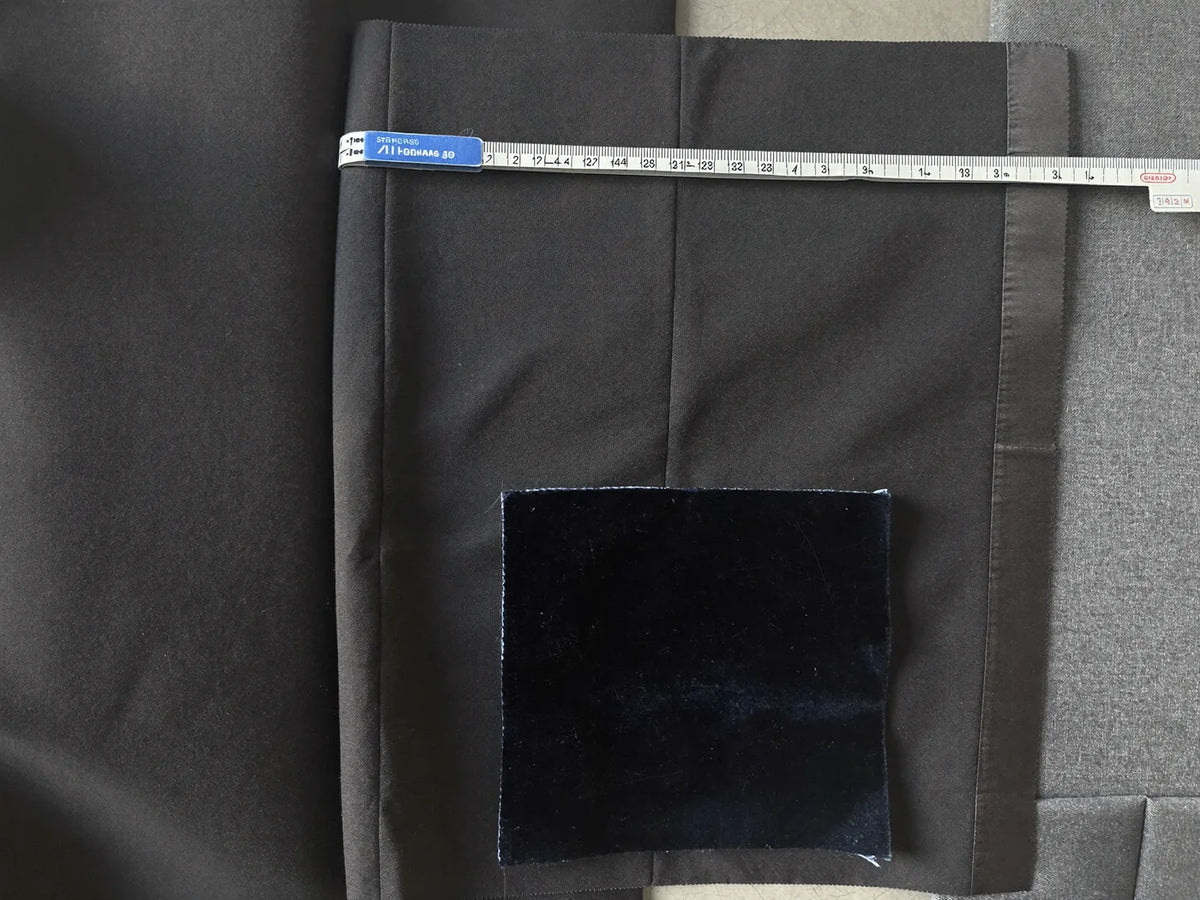 Formalwear fabric swatches in black wool with satin trim, midnight-blue velvet and grey suiting