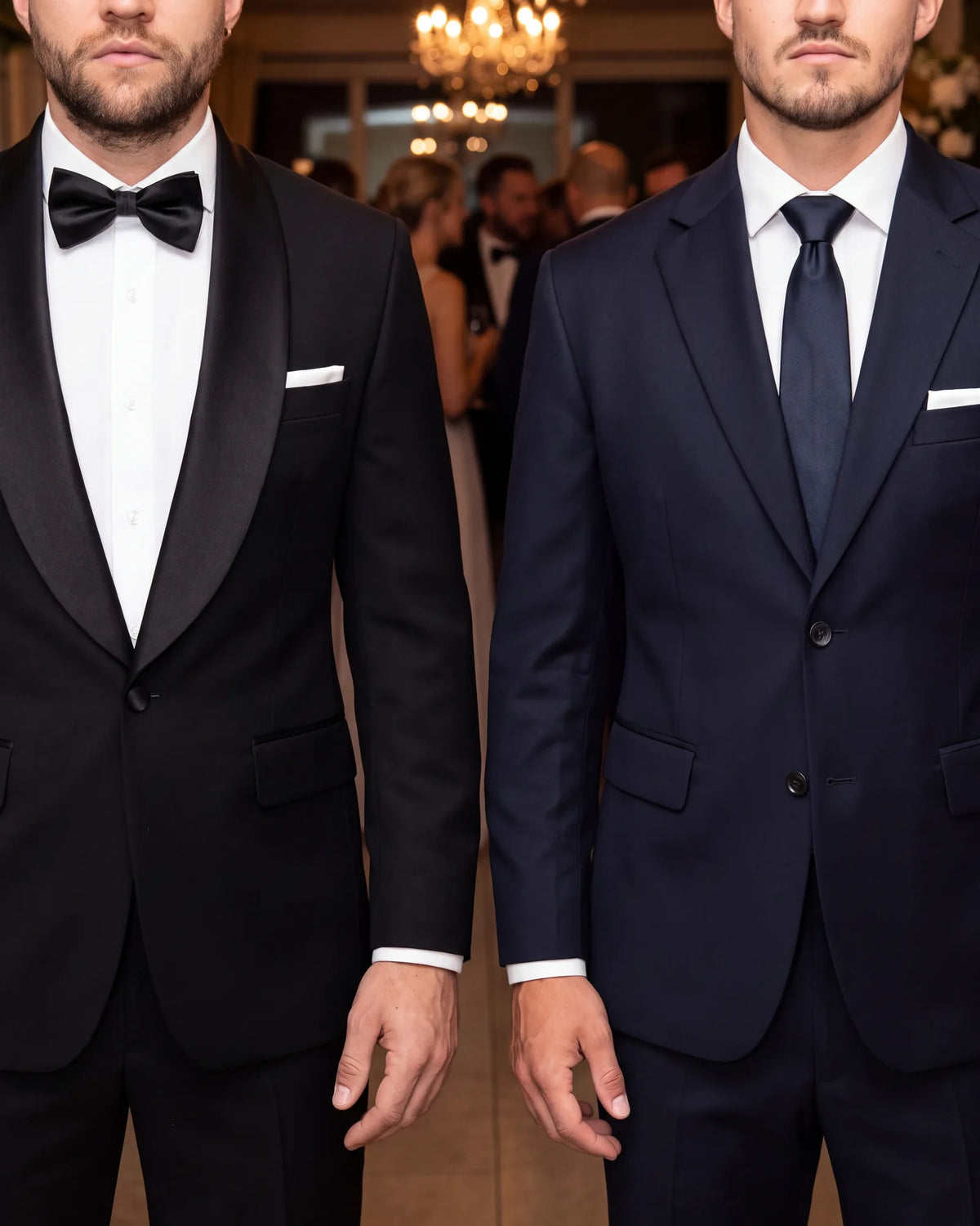 Look at the lapels to tell them apart. A satin or grosgrain facing marks the tuxedo, while the suit keeps its own cloth.