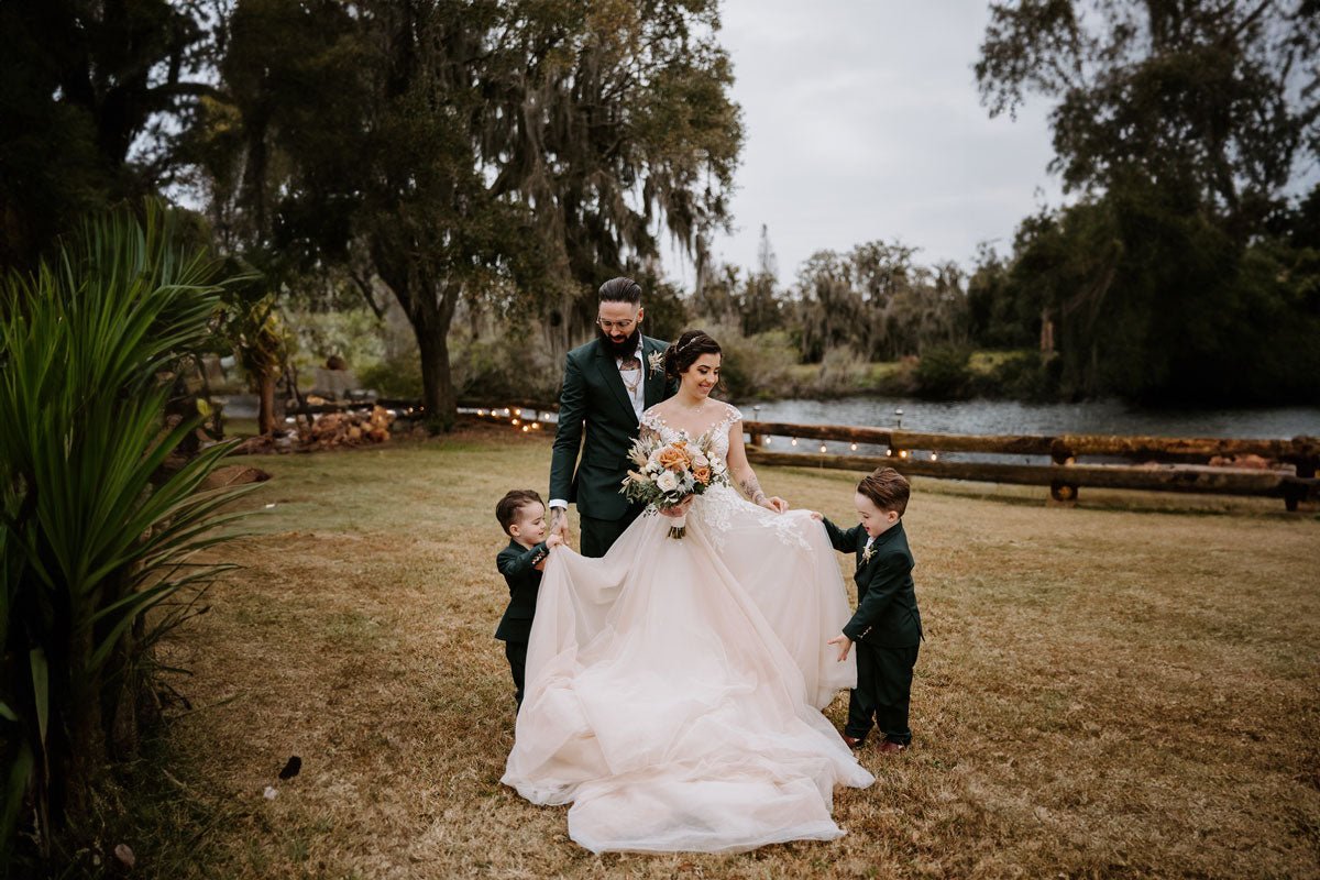 bride and groom walking across rocks in zion national park