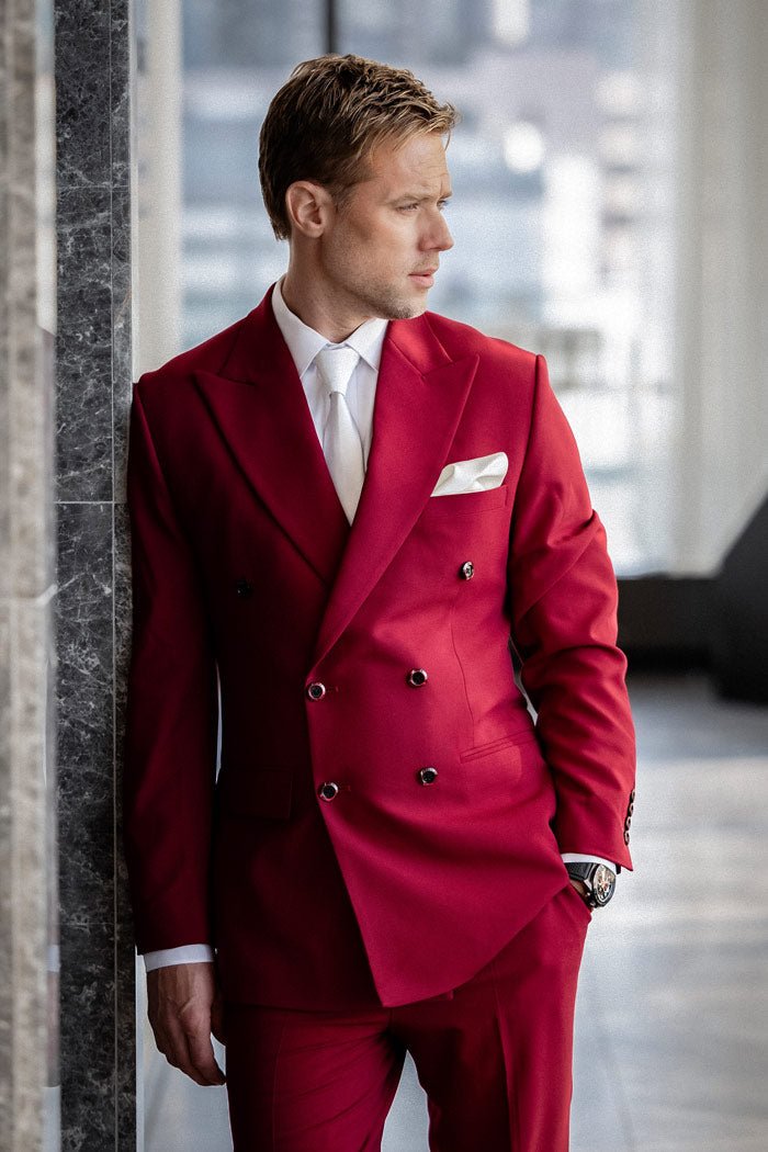 groom close up in his pink suit