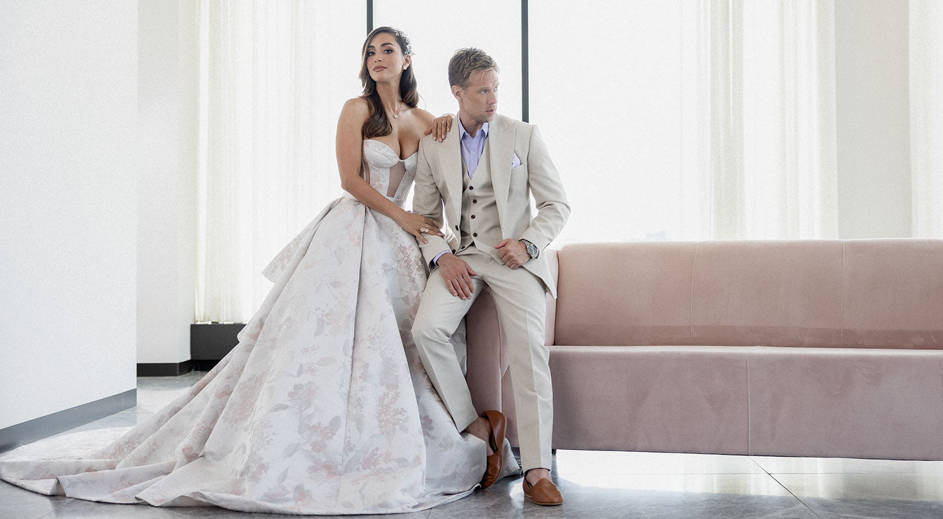 groom in champagne suit with bride