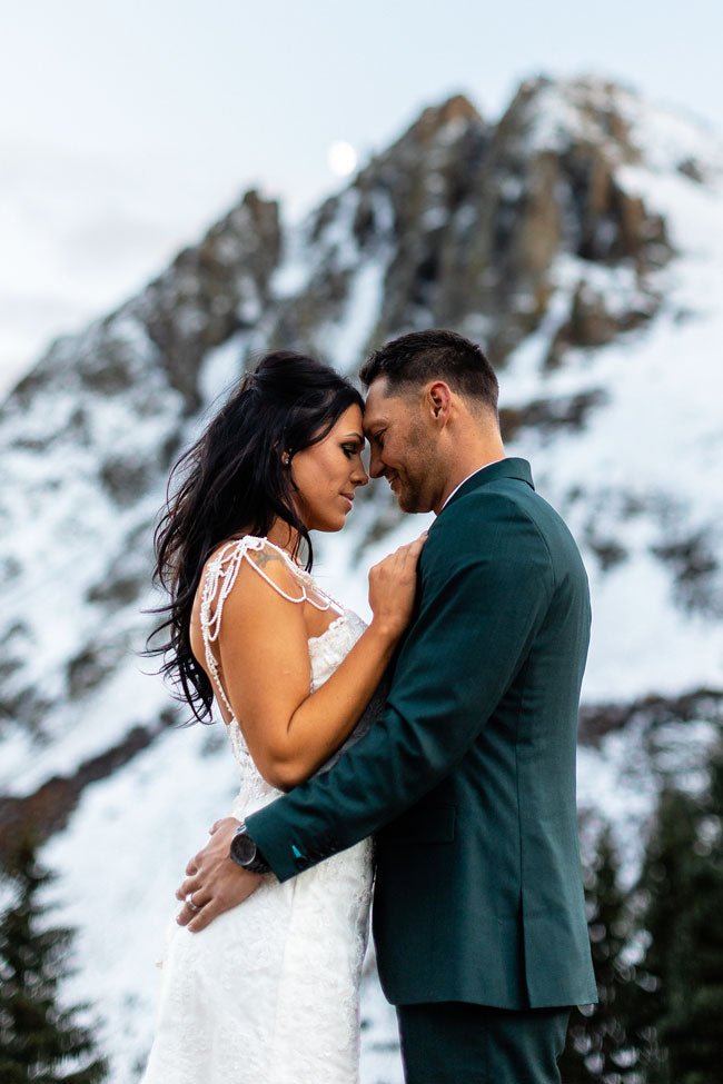 bride and groom in green suit