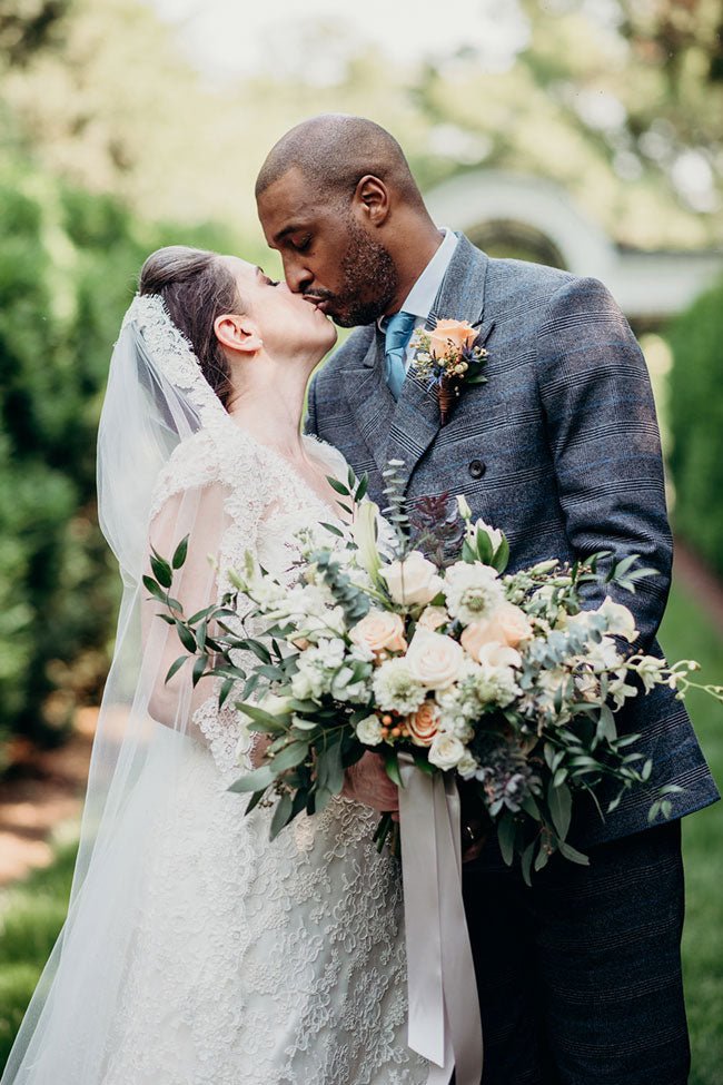 bride and groom in grey suit