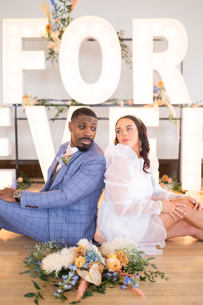 bride and groom in blue windowpane suit