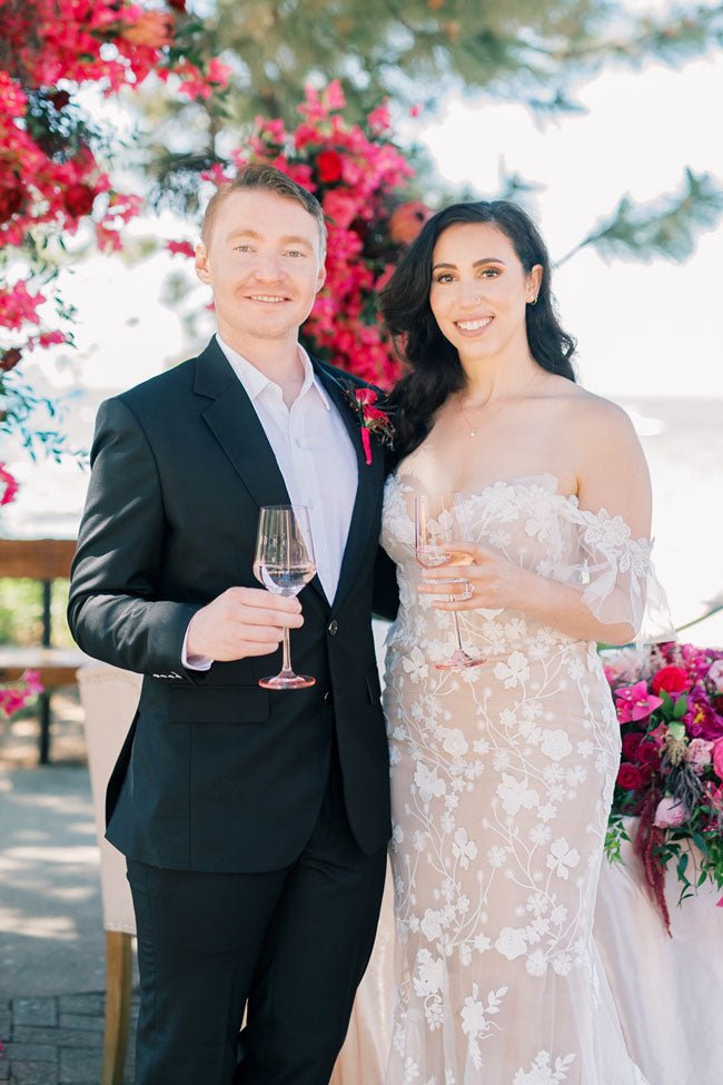 bride and groom holding champagne glasses for a toast