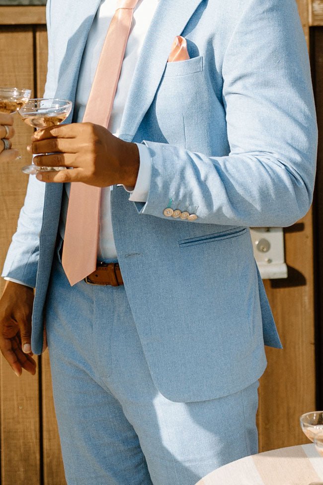 close up of groom's maya blue linen suit