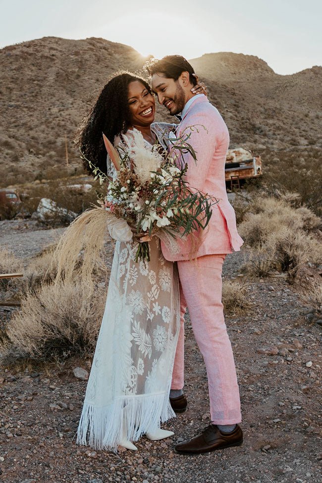 bride and groom in pink suit