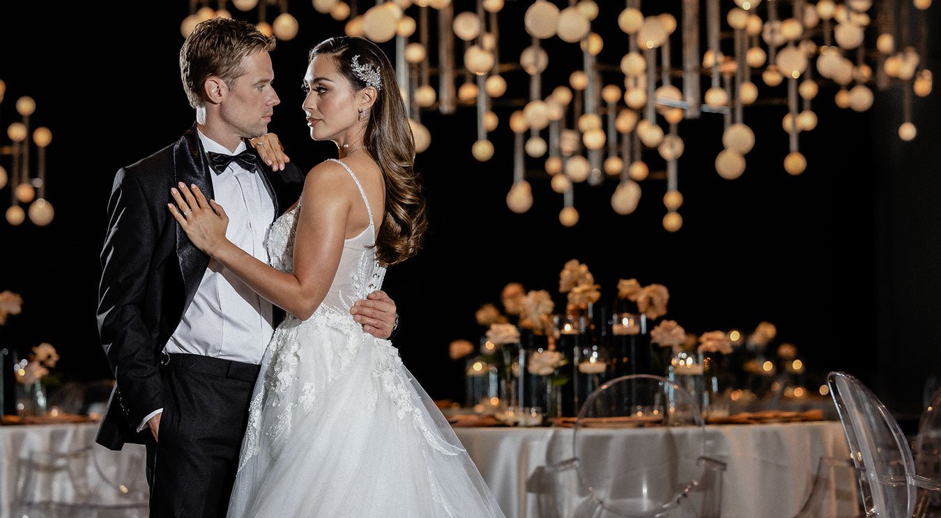 bride and groom in black tux and wedding dress