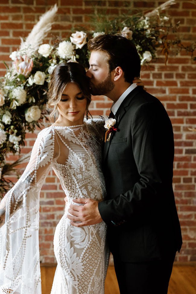 bride and groom in black suit