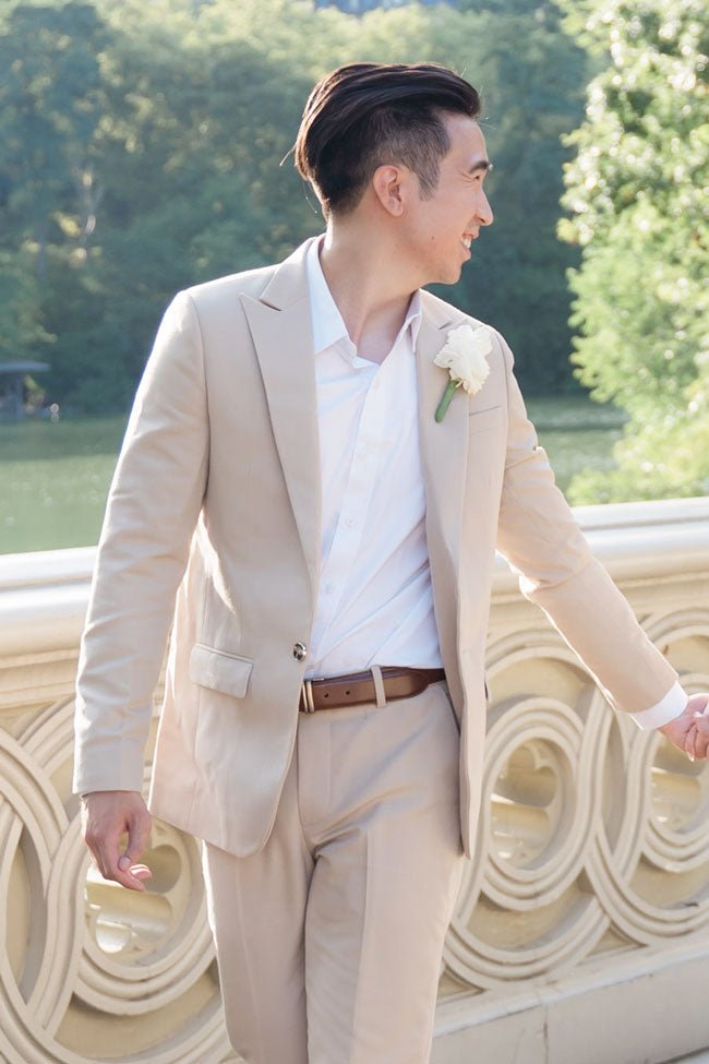 groom walking in dune beige suit